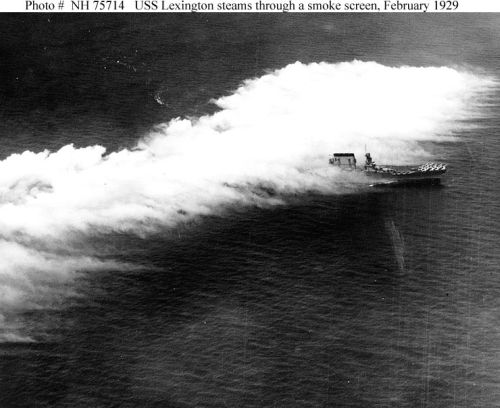 USS "Lexington" (CV-2) steams through an 
aircraft-deployed smoke screen, 26 February 1929, shortly after that year s "Fleet Problem" 
exercises.