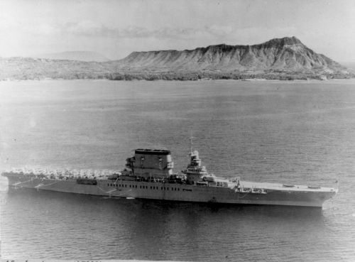 Aerial, starboard beam. Aircraft on deck, Diamond Head in background. February 2, 1933.