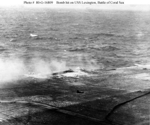 Flight deck damage on USS "Lexington" (CV-2), from a Japanese bomb that hit near the after end 
of the port forward 5-inch gun gallery, during the Battle of the Coral Sea, 8 May 1942.